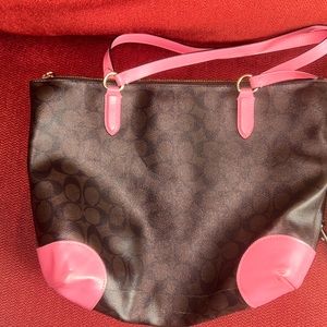 Brown coach bag with pink accent. Barely used. Clean -smoke free home